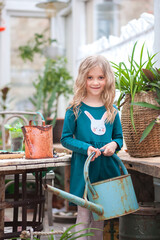 Fototapeta premium Stay at home. Home gardening in the greenhouse. Girls sisters and house plants. Urban jungle.