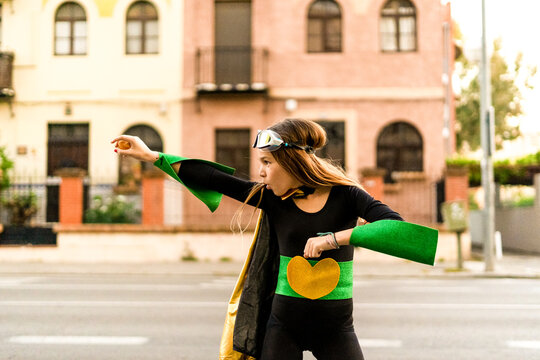 Girl posing in super heroine costume