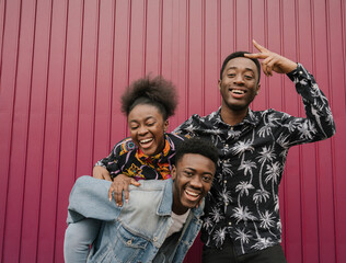 Group picture of three friends having fun together