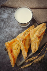 Chicken pie or kurnik that is beautifully decorated on the table. © artit