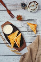 Chicken pie or kurnik that is beautifully decorated on the table. © artit