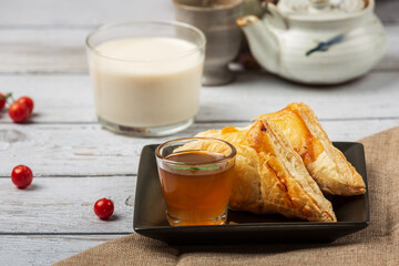 Chicken pie or kurnik that is beautifully decorated on the table. © artit