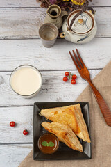 Chicken pie or kurnik that is beautifully decorated on the table. © artit