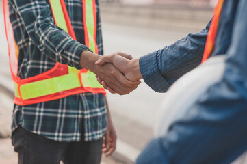 Teamwork Engineer shake hand agreement deal project construction success,Technician support partner cooperate team service contractor work building construction.