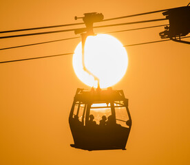 silhouette of a cable car at sunset