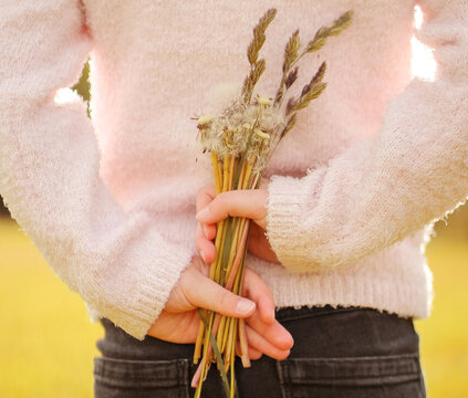 Bouquet of flowers in the hands of a girl