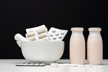 Black and white concept of probiotics and prebiotics. Medications to restore intestinal flora. The...