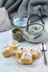 Vanilla cakes and chocolate cut into beautiful decorative pieces.