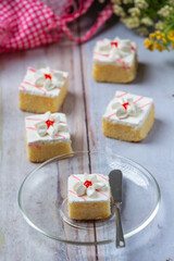 Vanilla cakes and chocolate cut into beautiful decorative pieces.