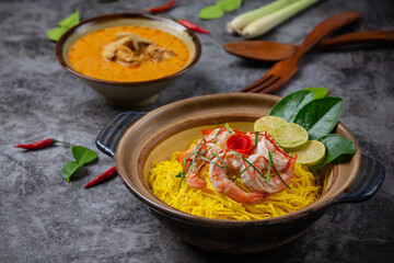 Northern Thai food (Khao Soi shrimp), spicy noodles decorated with ingredients.