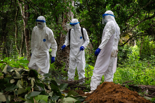 Lunsar, Sierra Leone, June 24, 2015: the burial team disinfects and prepare to burn used equipment. ebola response epidemic disease in Africa, ebola and corona virus context. Editorial use