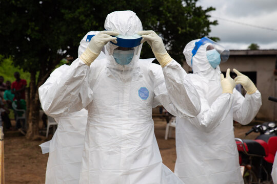Lunsar, Sierra Leone, July 8, 2015: Buerial team members ready to take a body in a village. ebola response epidemic disease in Africa, ebola and corona virus context. Editorial use