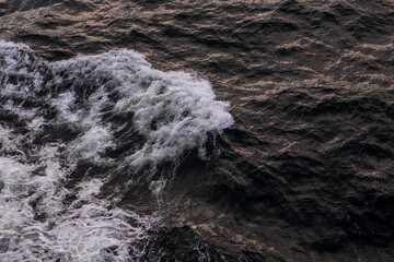 abstract water background with waves and foam