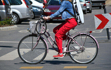 Woman with bicycle on the city street