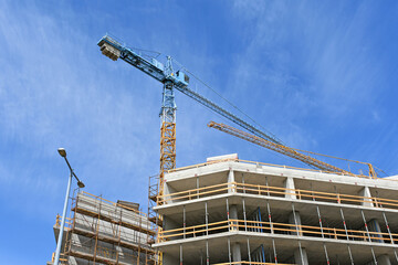 Tower crane at the construction of an apartment building