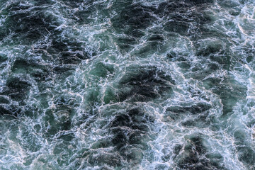 abstract water background with waves and foam