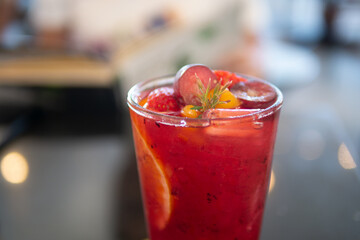 Herbal cold brew tropical fruit berries tea mocktail or cocktail drink beverage in cafe for healthy lifestyle and summer refreshment