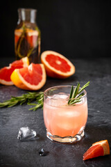 Pink Grapefruit Cocktail Spritze With Rosemary And Melting Ice