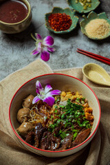 Dry thin noodles with stewed pork and pork ball.