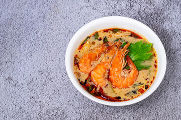 Spicy traditional Thai soup Tom yam kung or Tom yum with prawn,shrimps,coconut milk, lemongrass, lime and chills. Famous and popular food in Thailand and Thai Dish Cuisine.