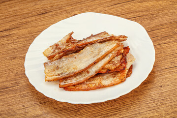 Roasted juicy bacon in the plate