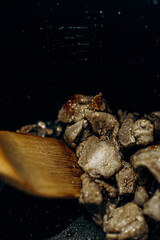 Pieces of meat are fried in oil. Large clan. . Home Cooking. Selective focus
