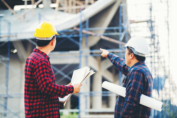 Two construction engineers Check the construction concept of the engineer and architect, work at...