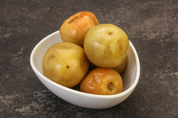 Pickled green tomato in the bowl