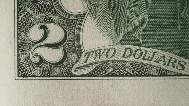 Two dollar banknote stop motion macro close up shot. Macro USD finance freedom and investment. 2 dollar depicted portrait of Thomas Jefferson. Nice cinematography documentary money footage.