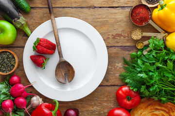 Frame of products, vegetables, herbs, oriental spices, white plate with space for text