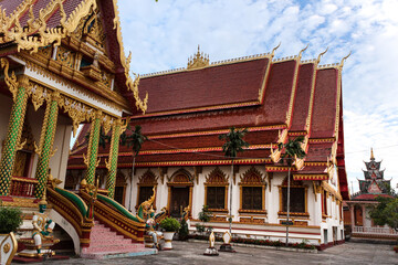 Fototapeta na wymiar Panoramic view of intensively decorated and painted temple main hall buildings Siamese Lao PDR, Southeast Asia