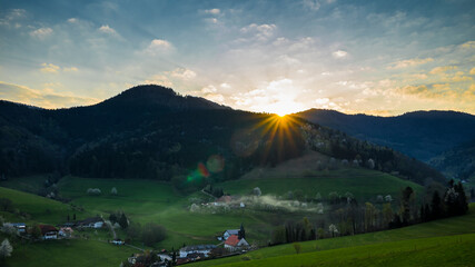 Germany, Romantic orange black forest nature landscape sunrise sky in early morning hours in elzach yach valley