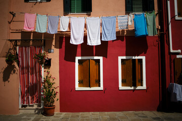 The colorful houses of Burano. Clothes hanging out to dry, Burano Island, Venice.