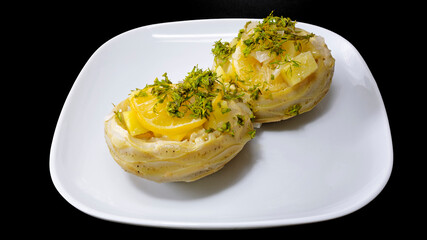 Homemade artichoke dish with potatoes, parsley and olive oil