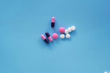 medical pills on blue background