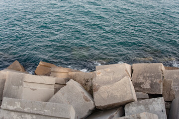 Barceloneta beach ocean and concrete groynes view horizontal