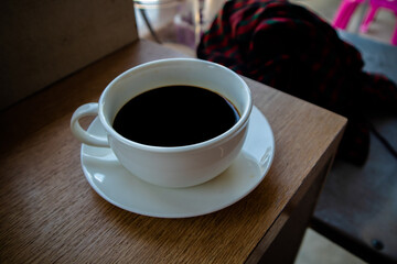 White tea set with black coffee in a glass