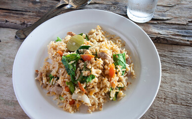 Pork fried rice on a white plate