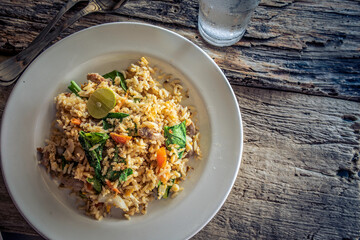 Pork fried rice on a white plate