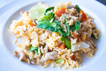 Pork fried rice on a white plate