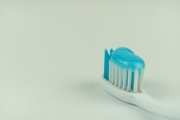 Old toothbrush on a white background