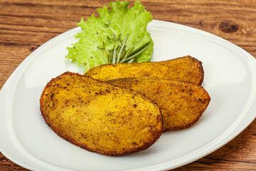 Baked potato with herbs and spices