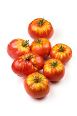 Fresh rustic tomatoes, isolated on white background