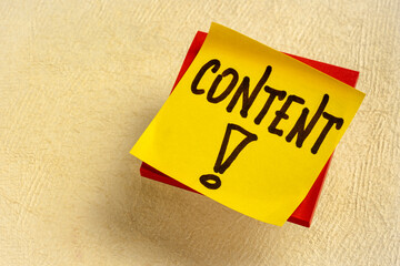 content reminder on a sticky note - blogging and communication concept