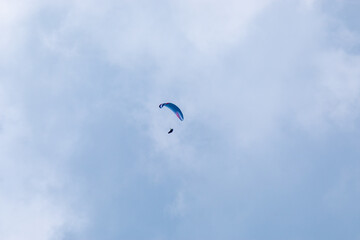 paragliding flying with parachutes in the clouds
