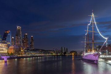 Puerto Madero at night, the buildings and the ship in Buenos Aires with the reflection of the...