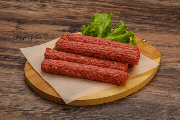 Raw beef sausages with spices