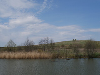 lake in the forest with blue sky