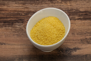 Raw cous cous heap in the bowl