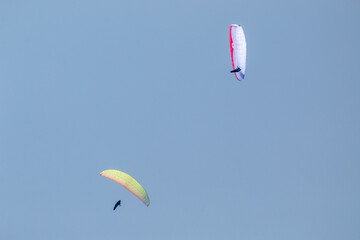 paragliding flying with parachutes in the clouds